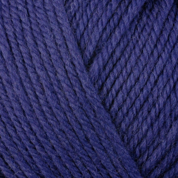 Detailed view of a skein of superwash wool yarn, showcasing a blue hue.