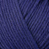 Detailed view of a skein of superwash wool yarn, showcasing a blue hue.