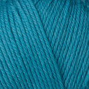 Detailed view of a skein of superwash wool yarn, showcasing a blue hue.