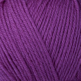 Detailed view of a skein of superwash wool yarn, showcasing a purple hue.
