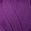 Detailed view of a skein of superwash wool yarn, showcasing a purple hue.