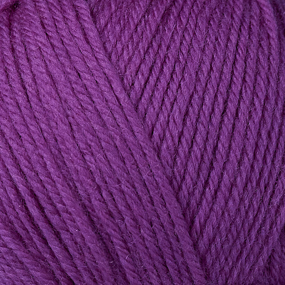 Detailed view of a skein of superwash wool yarn, showcasing a purple hue.