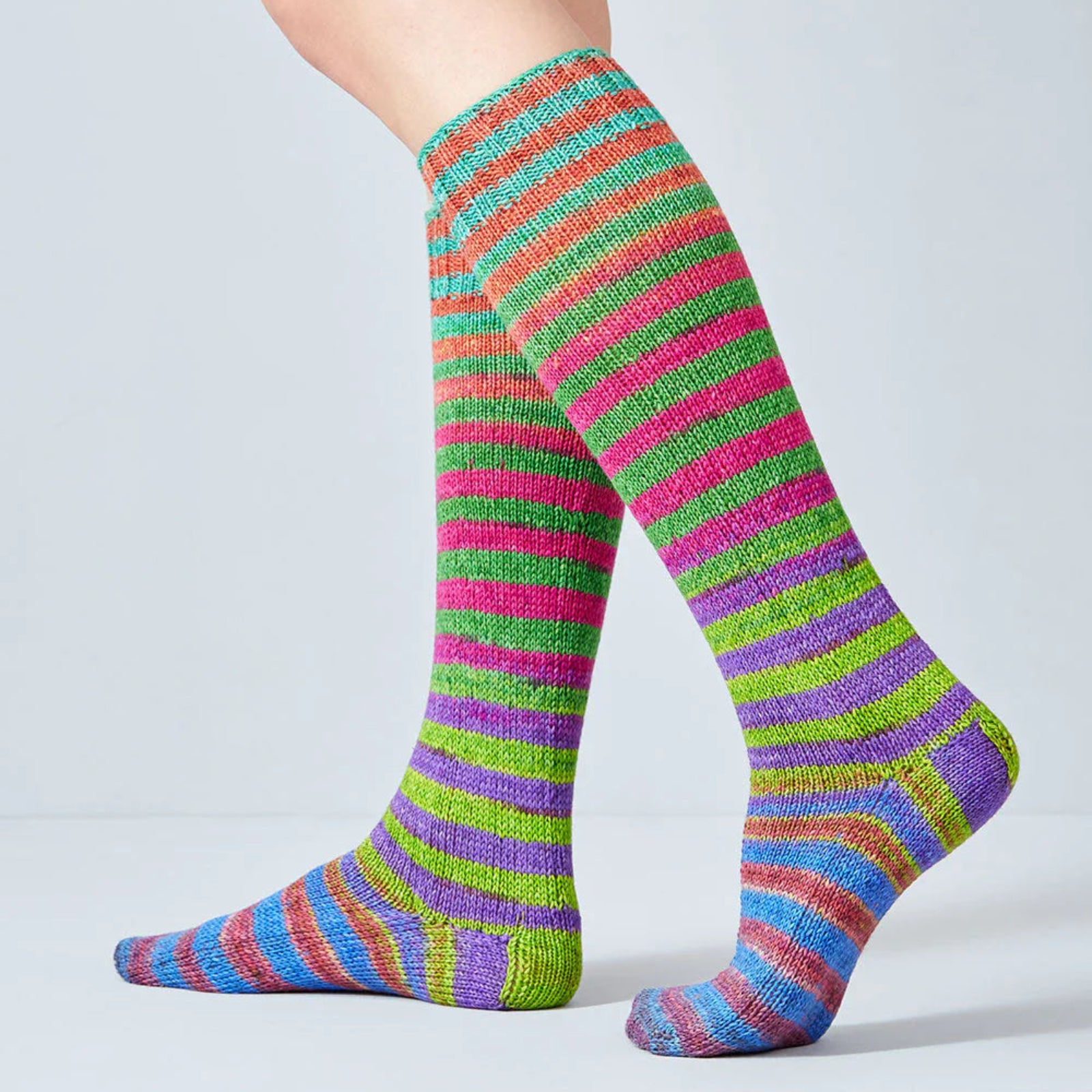 Colorful striped socks on a plain background