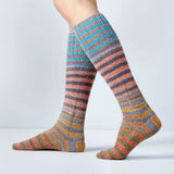 Multicolored striped socks on a plain background