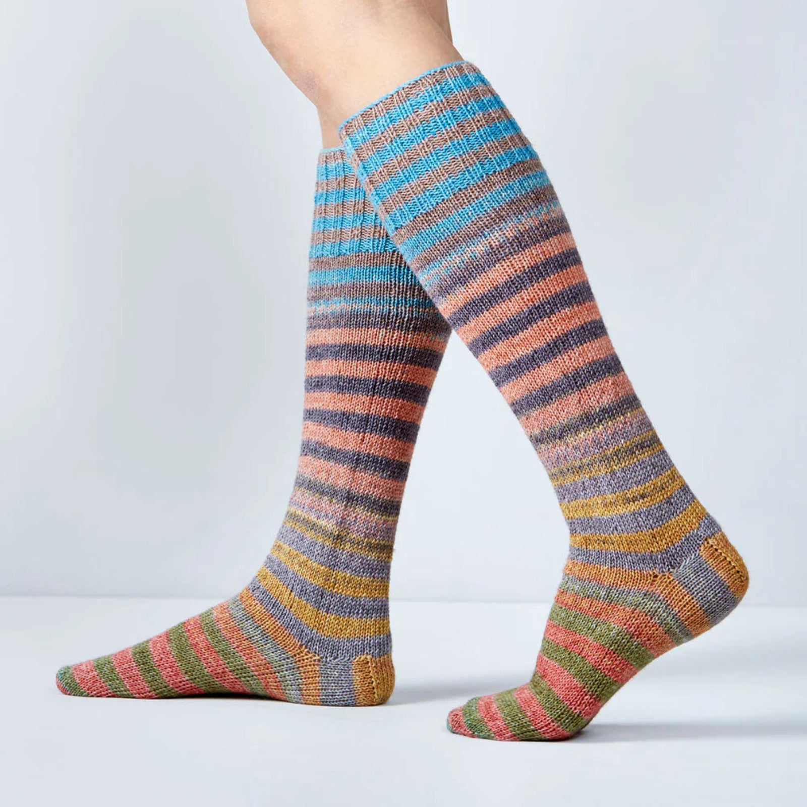 Multicolored striped socks on a plain background