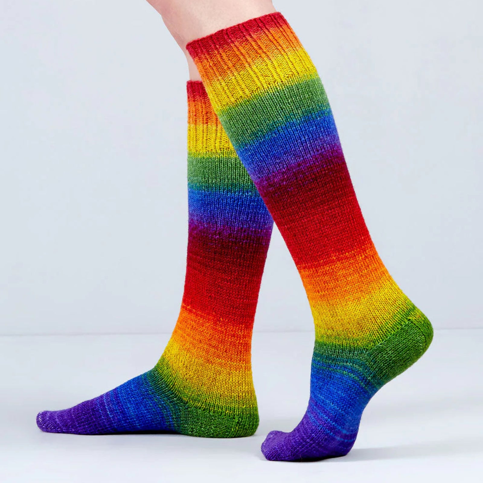 Colorful striped socks on a plain background