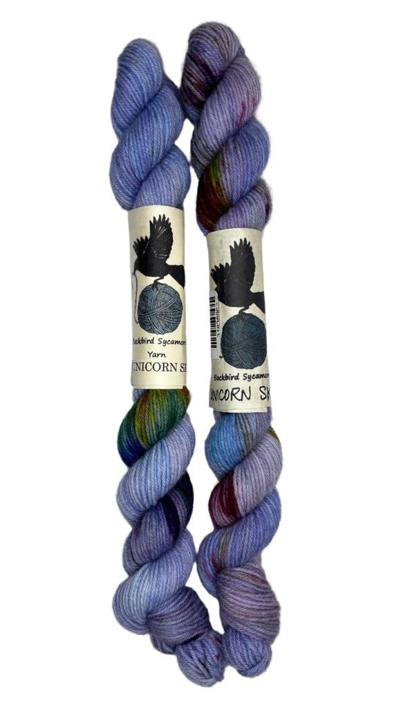 Mini Skeins of Hand Dyed yarn in the colors blue purple yellow green orange 