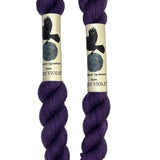 Mini skeins of hand dyed fingering weight yarn in the color violet