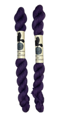 Mini skeins of hand dyed fingering weight yarn in the color violet