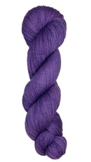 Skein of hand dyed fingering weight yarn in the color violet