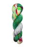 A skein of hand-dyed fingering/sock yarn color white yellow blue green red speckles