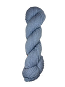 Light blue skein of mountain meadow wool yarn on a white background