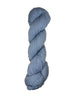 Light blue skein of mountain meadow wool yarn on a white background