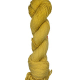 Yellow skein of mountain meadow wool yarn on a white background