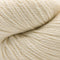 A close-up of cream-colored yarn with a soft, twisted texture filling the frame.