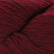 A close-up of dark red yarn with a soft, fuzzy texture, filling the entire frame.