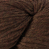 A close-up of dark brown yarn with subtle red and beige variegated threads, showing the fuzzy texture of the fibers.