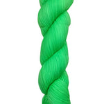 A skein of hand-dyed fingering/sock yarn color green 