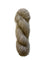 A single twisted skein of soft, fuzzy yarn in a light oatmeal beige color, photographed on a plain white background.