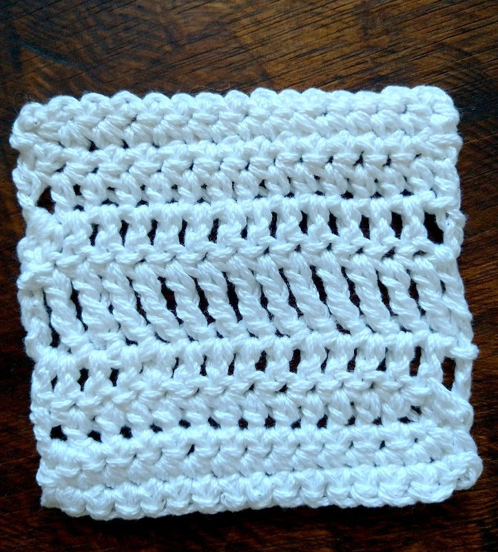 A white crocheted coaster that will be made during the begin to crochet class