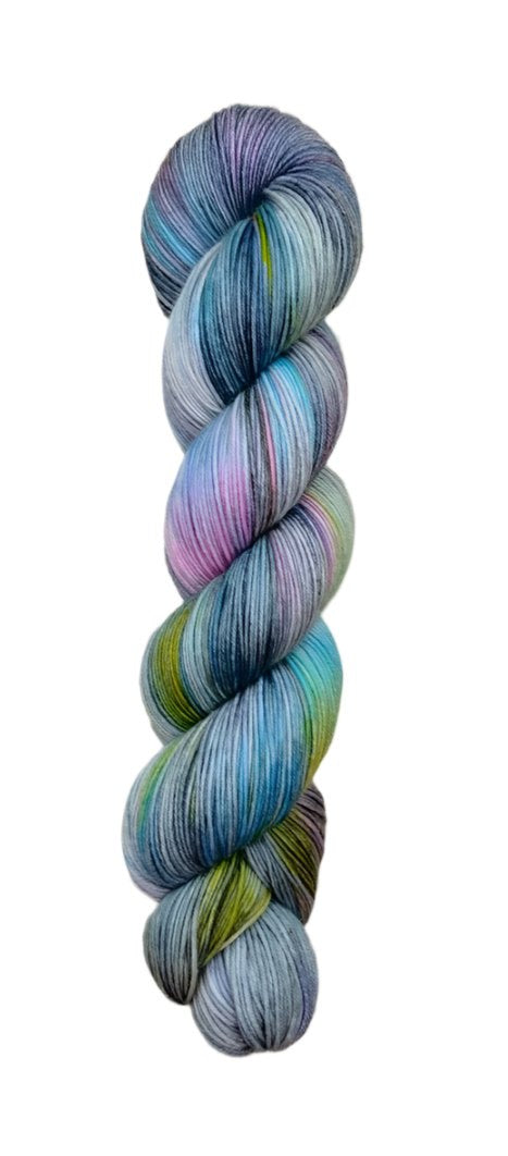 A skein of hand-dyed fingering/sock yarn color grey blue pink green black