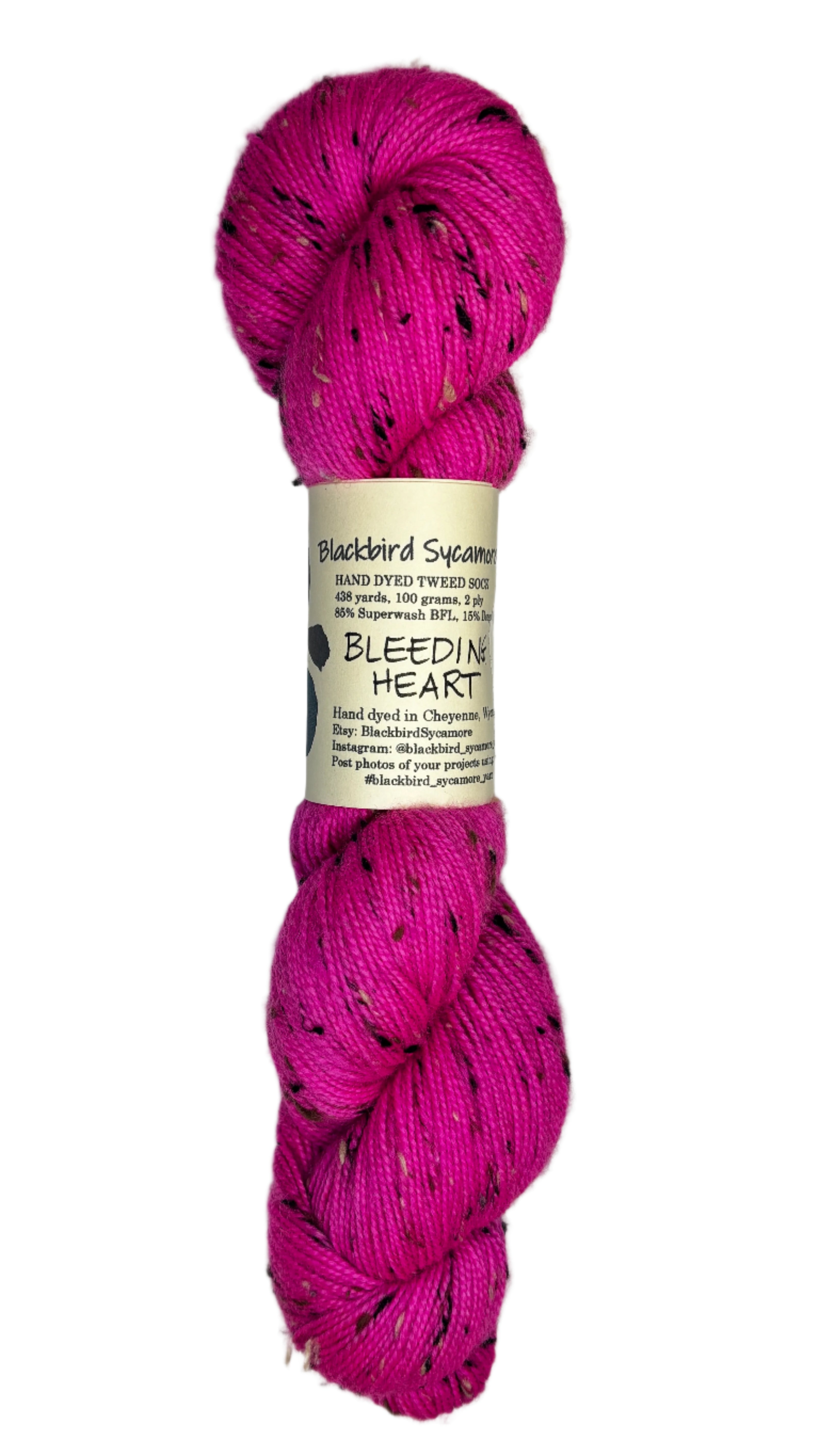 bright pink skein of tweed yarn