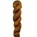 Skein of superkid mohair silk lace weight yarn color golden brown