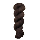Dark brown skein of yarn on a light beige background