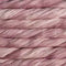 A close-up of twisted yarn or thread strands in a dusty mauve-pink color with subtle tonal variation.