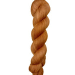 Skein of hand dyed BFL Tweed Yarn color orange