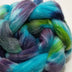 a braid of ready to be spun fiber color blue green