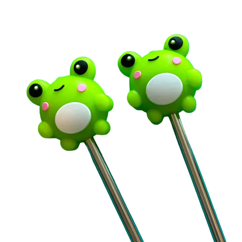 Two green frog-shaped stitch stoppers  on metal needles