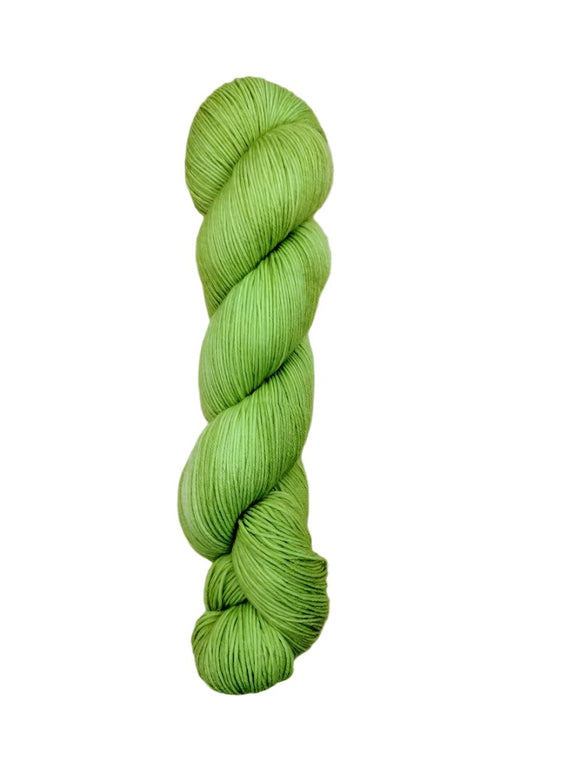 Skein of hand dyed BFL Tweed Yarn color lettuce green