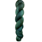 Skein of hand dyed BFL Tweed Yarn color green