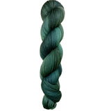 Skein of hand dyed BFL Tweed Yarn color green