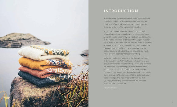 Stack of folded knitted sweaters on a rock by a body of water with text on a gray background