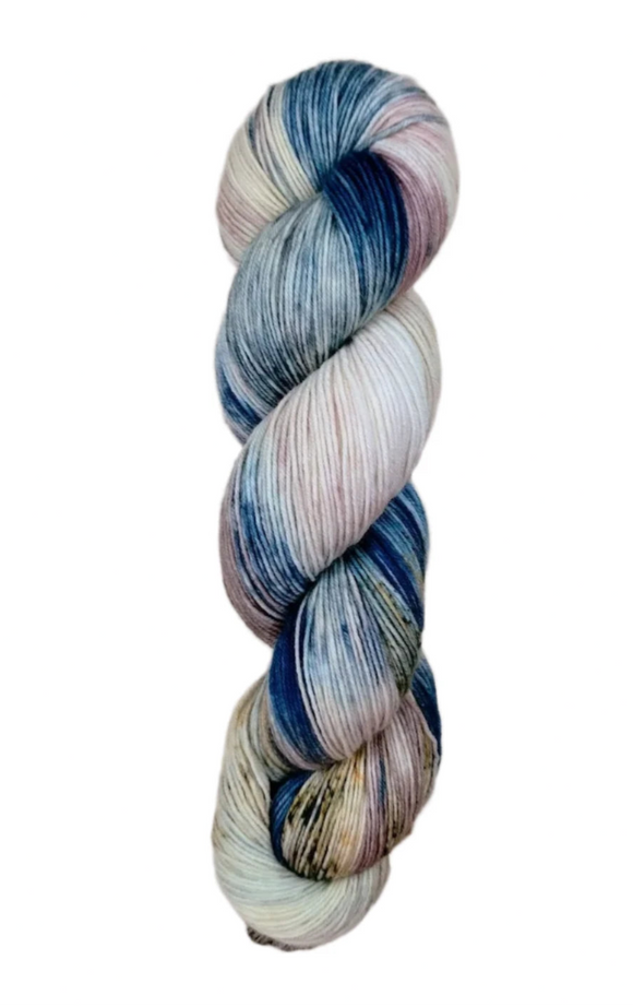 A skein of hand-dyed fingering/sock yarn color pink white blue brown speckles