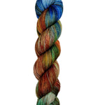 Multicolored skein of yarn on a light wooden surface