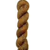 Skein of hand dyed BFL Tweed Yarn color golden brown