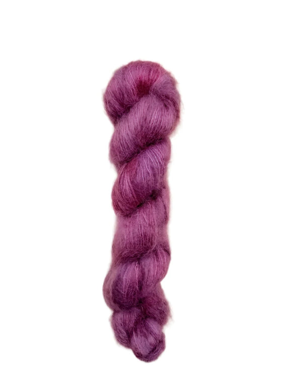 Skein of superkid mohair silk lace weight yarn color red 