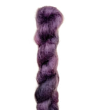 Skein of superkid mohair silk lace weight yarn color purple black