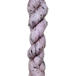 Skein of hand dyed BFL Tweed Yarn color dusty rose