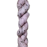 Skein of hand dyed BFL Tweed Yarn color dusty rose