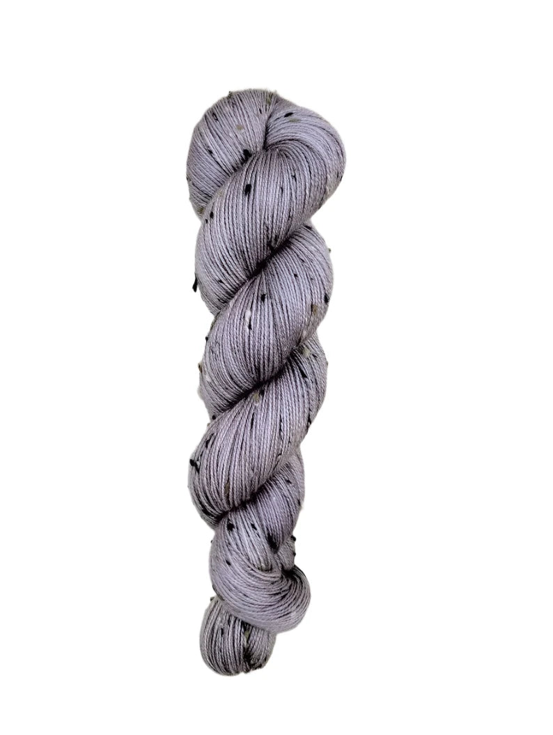 Skein of hand dyed BFL Tweed Yarn color grey