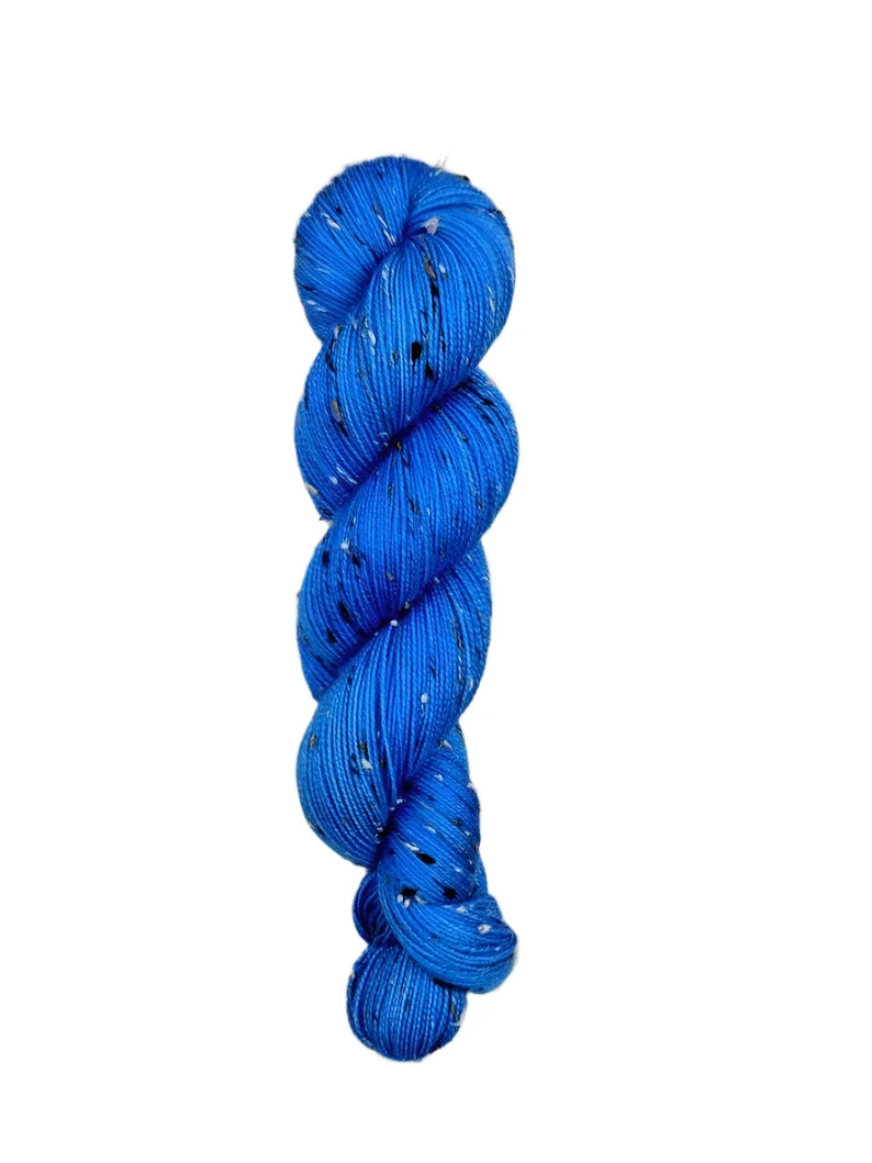 Skein of hand dyed BFL Tweed Yarn color blue