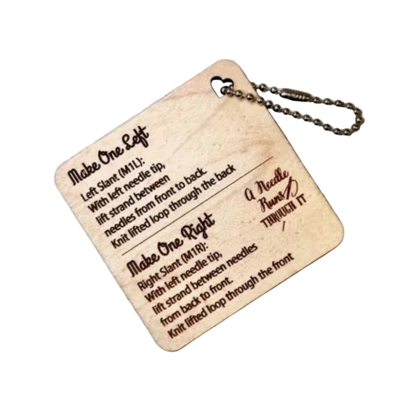 A square wooden keychain plaque with engraved instructions on how to do a make 1 left and make 1 right knit stitch, attached to a metal ball chain