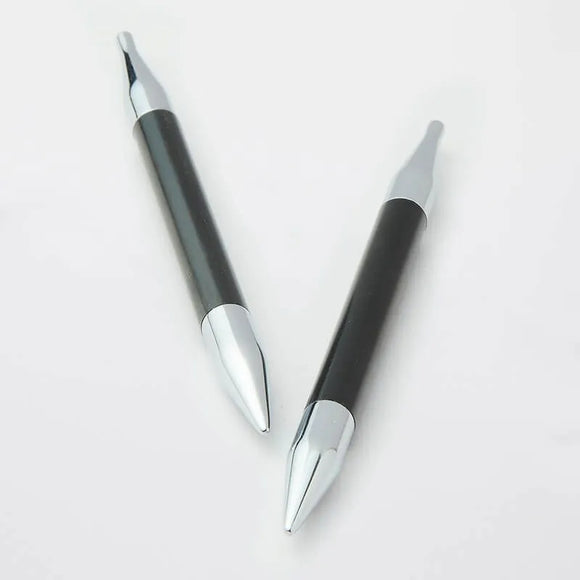 Two black and silver pens on a white background