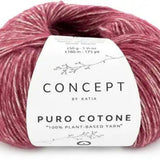 Ball of light red yarn with a 'Concept by Katia' label on a white background