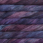 close up view of malabrigo silkpaca lace weight yarn color purple blue