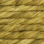 close up view of malabrigo silkpaca lace weight yarn color golden yellow
